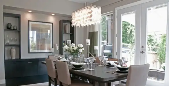 Elegant dining room chandelier installation above table in Boise, ID