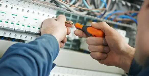 electrical service showing licensed electrician performing electrical panel maintenance and adjustments in Boise, ID