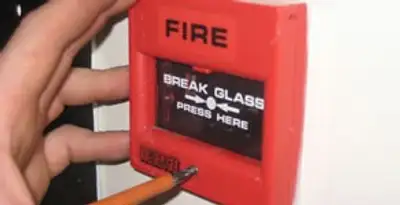 fire alarm installation service showing manual fire alarm pull station installed by licensed electricians in Boise, ID