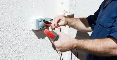 Electrician performing home electrical outlet and wiring inspection in Boise, ID