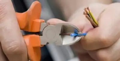 professional electrical services showing precise wire cutting by licensed electricians in Boise, ID