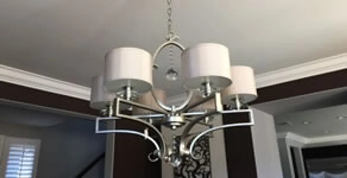 Modern chandelier installation with multiple light fixtures in Boise, ID