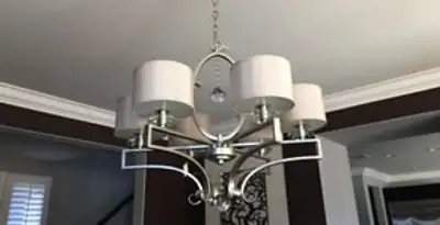 Modern chandelier installation with multiple light fixtures in Boise, ID