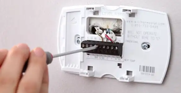 Thermostat installation service with proper wiring and secure wall mounting in Boise, ID
