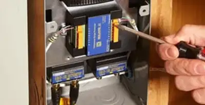 Whole home surge protection device being installed by a licensed electrician to protect electrical systems in Boise, ID